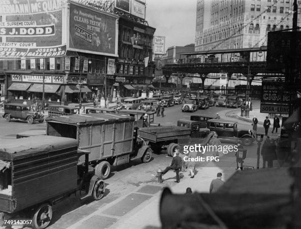 Traffic at the corner of Flatbush Avenue and Atlantic Avenue in Brooklyn, New York City, 1929. At top right is an election poster for Supreme Court...