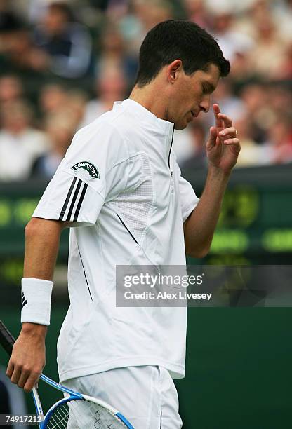 Tim Henman of Great Britain reacts during the Men's Singles first round match against Carlos Moya of Spain during day two of the Wimbledon Lawn...