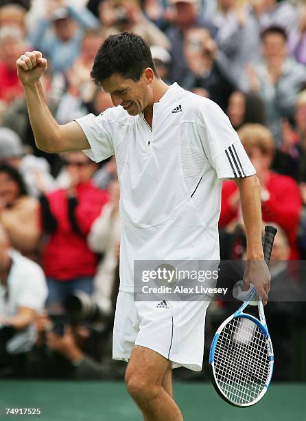 Tim Henman of Great Britain clenches his fist following victory during the Men's Singles first round match against Carlos Moya of Spain during day...