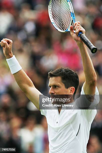 Tim Henman of Great Britain celebrates following victory during the Men's Singles first round match against Carlos Moya of Spain during day two of...