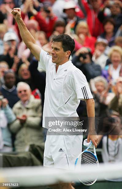 Tim Henman of Great Britain celebrates following victory during the Men's Singles first round match against Carlos Moya of Spain during day two of...