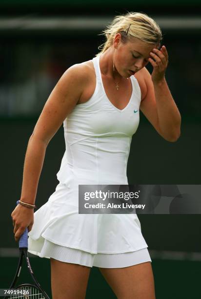 Maria Sharapova of Russia looks thoughtful during the Women's Singles first round match against Yung-Jan Chan of Chinese Taipei during day two of the...