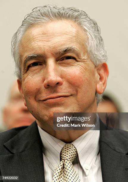 Commissioner Roel Campos participates in a House Financial Services Committee hearing on Capitol Hill June 26, 2007 in Washington, DC. The committee...