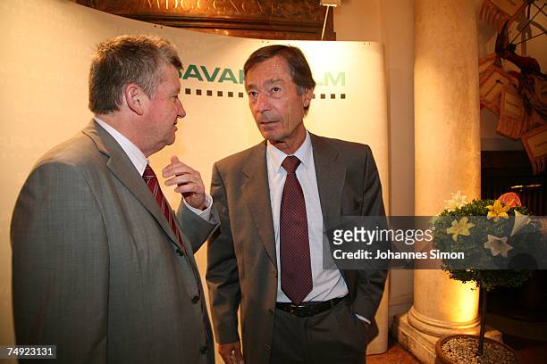 Matthias Esche and Dieter Frank, CEO's of the Bavaria film company chat together during a reception of the Bavaria film company on June 26 in Munich,...