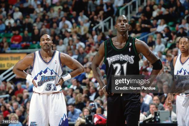 Kevin Garnett of the Minnesota Timberwolves matches up against Karl Malone of the Utah Jazz during a 2001 NBA game at the Delta Center in Salt Lake...