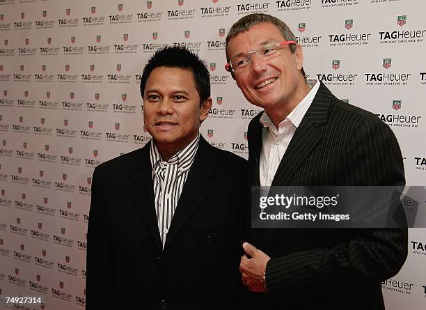 Tag Heuer Jean-Christophe Babin and Soetikno Soedarjo of Indonesia pose as they arrive to attend the Tag Heuer Grand Carrera Event, on June 26, 2007...