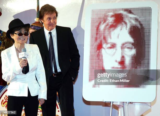 Yoko Ono and Sir Paul McCartney stand next to a plaque of John Lennon during a dedication ceremony for the plaque and one for George Harrison as part...