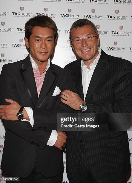 Actor Louis Koo of Hong Kong poses with Tag Heuer watches company C.E.O Jean-Christophe Babin as he arrives to attend the Tag Heuer Grand Carrera...