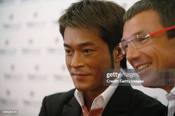 Heuer Jean-Christophe Babin and actor Louis Koo of Hong Kong pose as they arrive to attend the Tag Heuer Grand Carrera Event, on June 26, 2007 in Le...