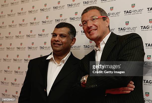 Heuer Jean-Christophe Babin and Dato Tony Fernandez, CEO Air Asia Bhd, pose as they arrive to attend the Tag Heuer Grand Carrera Event, on June 26,...