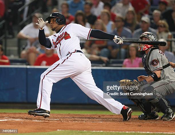 Andruw Jones of the Atlanta Braves hits a fifth inning home run against the Washington Nationals at Turner Field June 26, 2007 in Atlanta, Georgia....