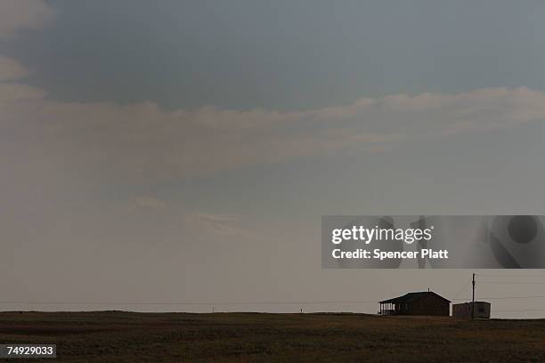 Home on an isolated stretch of land June 26, 2007 in Laramie, Wyoming. While Wyoming is the least populous of any state in America, it is also a...