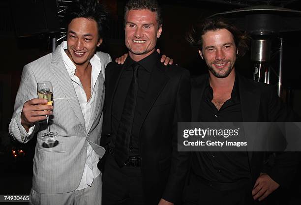 Singer Peter Ho of China poses with Formula one driver David Coulthard and Singer Jay Kay of U.K during the Tag Heuer Grand Carrera event on June 26,...