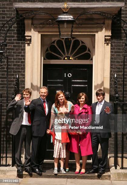 Prime Minister Tony Blair stands with his family Euan, Kathryn, Leo, Cherie and Nicholas as he leaves Downing Street for the last time on June 27,...