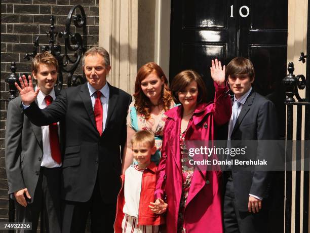 Prime Minister Tony Blair poses with his family Euan, Leo, Kathryn, wife Cherie and Nicholas before leaving his Downing St Residence for the last...