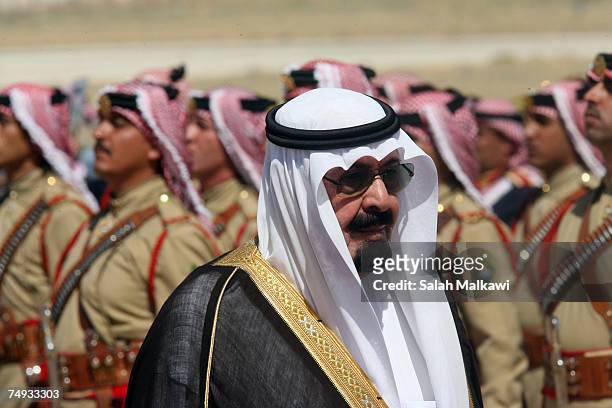 King Abdullah of Saudi Arabia reviews a guard of honour during a reception held by to King Abdullah of Jordan upon his arrival on June 27, 2007 in...