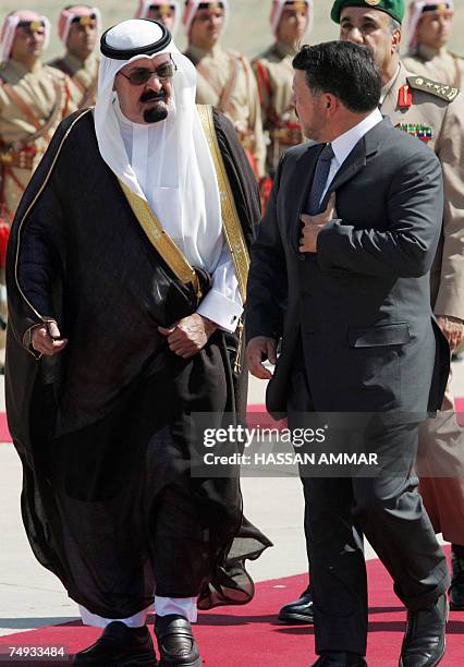 Jordanian King Abdullah II greets Saudi King Abdullah bin Abdul Aziz al-Saud as he arrives for his visit to the Jordanian capital Amman, 27 June...