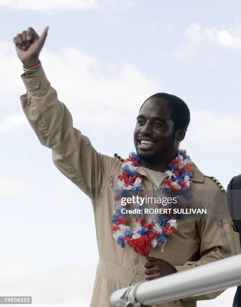 Solo pilot Barrington Irving of the United States waves after landing at Opa-Locka Airport in Miami, Florida 27 June 2007. The 23-year-old...