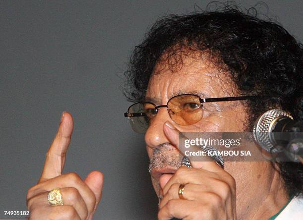 Libyan leader Moamer Kadhafi speaks during a meeting with Ivorian youth at the Culture palace 27 June 2007 in Abidjan. Kadhafi arrived in Ivory Coast...