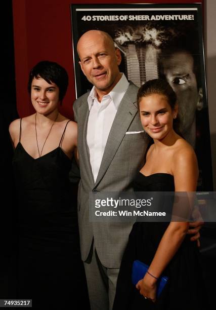 Actor Bruce Willis poses with his daughters Rumer and Tallulah after donating objects from the "Die Hard" series of films to the Smithsonian's...