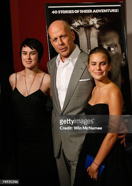 Actor Bruce Willis poses with his daughters Rumer and Tallulah after donating objects from the "Die Hard" series of films to the Smithsonian's...