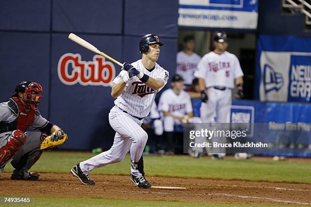 Joe Mauer of the Minnesota Twins bats in a game against the Atlanta Braves at the Humphrey Metrodome in Minneapolis, Minnesota on June 12, 2007. The...