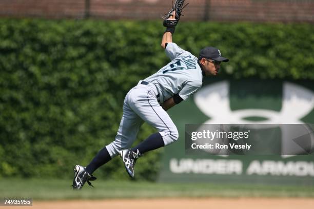 Ichiro Suzuki of the Seattle Mariners throws during the Interleague game against the Chicago Cubs at Wrigley Field in Chicago, Illinois on June 14,...