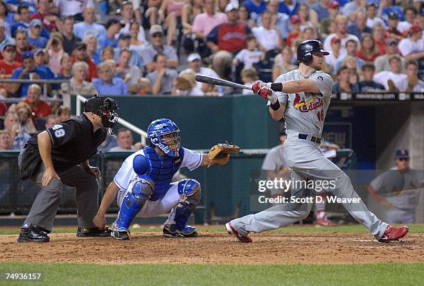 Chris Duncan of the St. Louis Cardinals hits a home run during the game against the Kansas City Royals at Kauffman Stadium in Kansas City, Missouri...