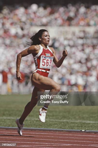 Florence Griffith-Joyner of the United States running to win the gold medal in the Women's 100 metres final event during the XXIV Summer Olympic...