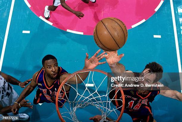 Chris Dudley and Charlie Ward of the New York Knicks battle for the rebound during Game One of the 1999 NBA Finals played at the Alamodome on June...
