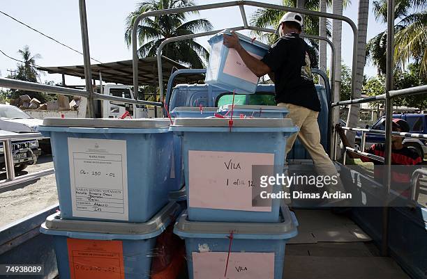 An election official loads ballot boxes into a truck for distribution to remote areas two days before elections on June 28, 2007 in Dili, East Timor....