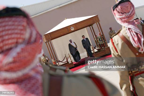 Saudi King Abdullah bin Abdul Aziz al-Saud stands with Jordan's King Abdullah II during a ceremony for his arrival for a visit to the Jordanian...