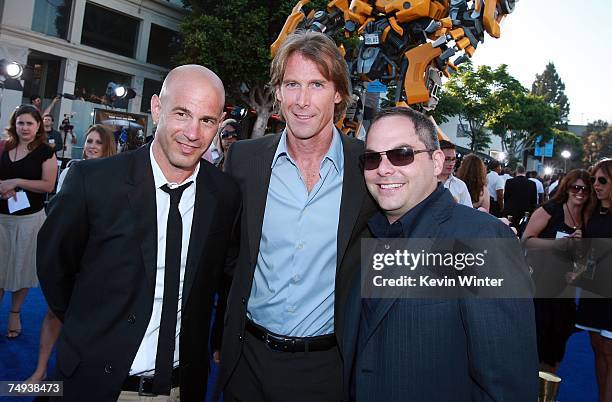 Paramount's Brad Weston, director Michael Bay, and Paramount's Adam Goodman arrive to Paramount Pictures' premiere of "Transformers" held at Mann's...