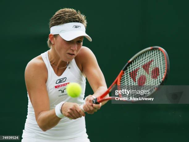 Michaella Krajicek of the Netherlands plays a backhand during the Women's Singles second round match against Katie O'Brien of Great Britain during...