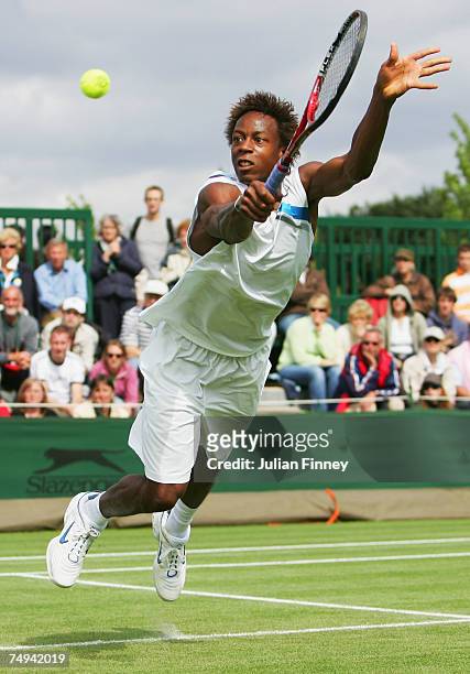 Gael Montfils of France dives to hit a backhand during the Men's Singles second round match against Kristof Vliegen of Belgium during day four of the...