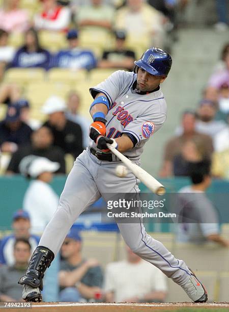 Carlos Beltran of the New York Mets connects with the pitch against the Los Angeles Dodgers at Dodger Stadium June 13, 2007 in Los Angeles,...