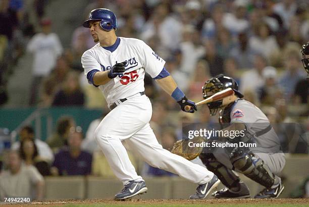 Russell Martin of the Los Angeles Dodgers makes a hit against the New York Mets at Dodger Stadium June 13, 2007 in Los Angeles, California.