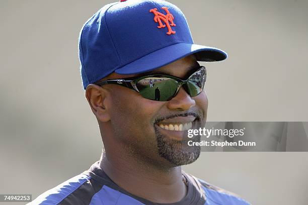 Carlos Delgado of the New York Mets waits his turn to take batting practice before the game with the Los Angeles Dodgers at Dodger Stadium June 13,...