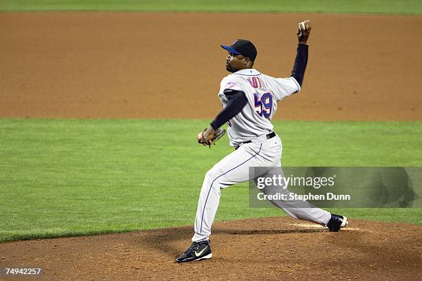 Guillermo Mota of the New York Mets delivers the pitch against the Los Angeles Dodgers at Dodger Stadium June 13, 2007 in Los Angeles, California.