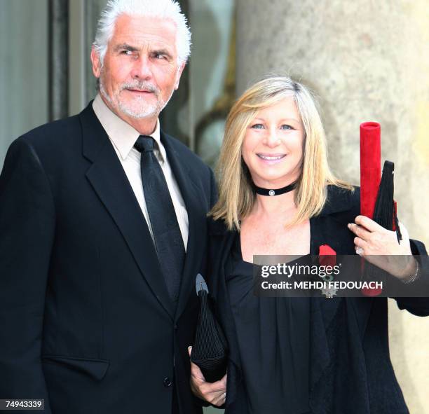 Singer Barbra Streisand poses with her husband James Brolin as she leaves the Elysee Palace after being awarded by French President Nicolas Sarkozy...