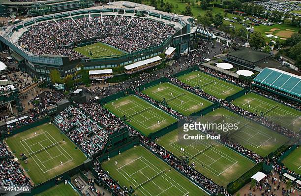 An aerial view a roofless Centre Court and the outside courts taken from the BBC elevated camera position during day four of the Wimbledon Lawn...