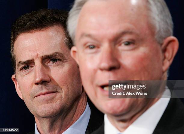 Sen. Jeff Sessions speaks as Sen. Jim DeMint looks on during a news conference after a cloture vote on an immigration reform bill June 28, 2007 on...