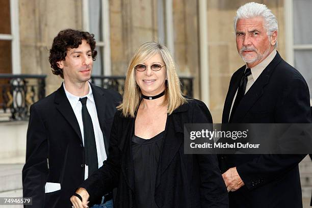 Jason Gould, Barbra Steisand and James Brolin attend a formal ceremony at the Elysee Palace honoring Streisand with an induction into France's Legion...