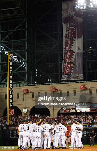 Second baseman Craig Biggio of the Houston Astros celebrates with his team after getting his 3,000th career hit against the Colorado Rockies in the...