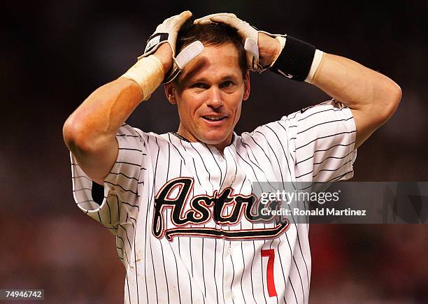 Second baseman Craig Biggio of the Houston Astros reacts after getting his 3,000th career hit against the Colorado Rockies in the 7th inning on June...