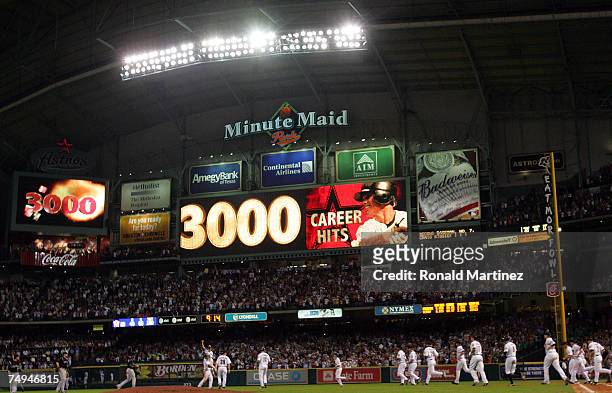 Second baseman Craig Biggio of the Houston Astros celebrates with his team after getting his 3,000th career hit against the Colorado Rockies in the...