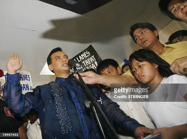Opposition candidate and now a newly-elected Senator, Lt. Senior Grade Antonio Trillanes takes his oath of office in his hometown of Caloocan city...