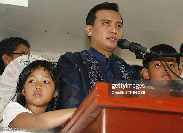 Opposition candidate and newly-elected senator, Lt Senior Grade Antonio Trillanes addresses his supporters after taking his oath of office in his...