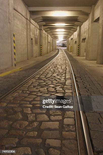 Railroad tracks lead through an underground passage once used for building German fighter aircraft during Wold War II, under Tempelhof Airport June...