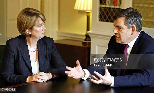 London, UNITED KINGDOM: Britain's Prime Minister Gordon Brown talks with Home Secretary Jacqui Smith after a meeting of the government's top...